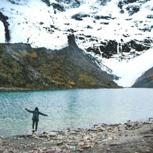 person standing near lake at daytime