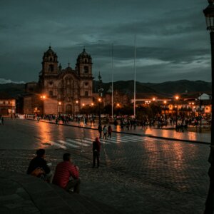 people walking on street during night time